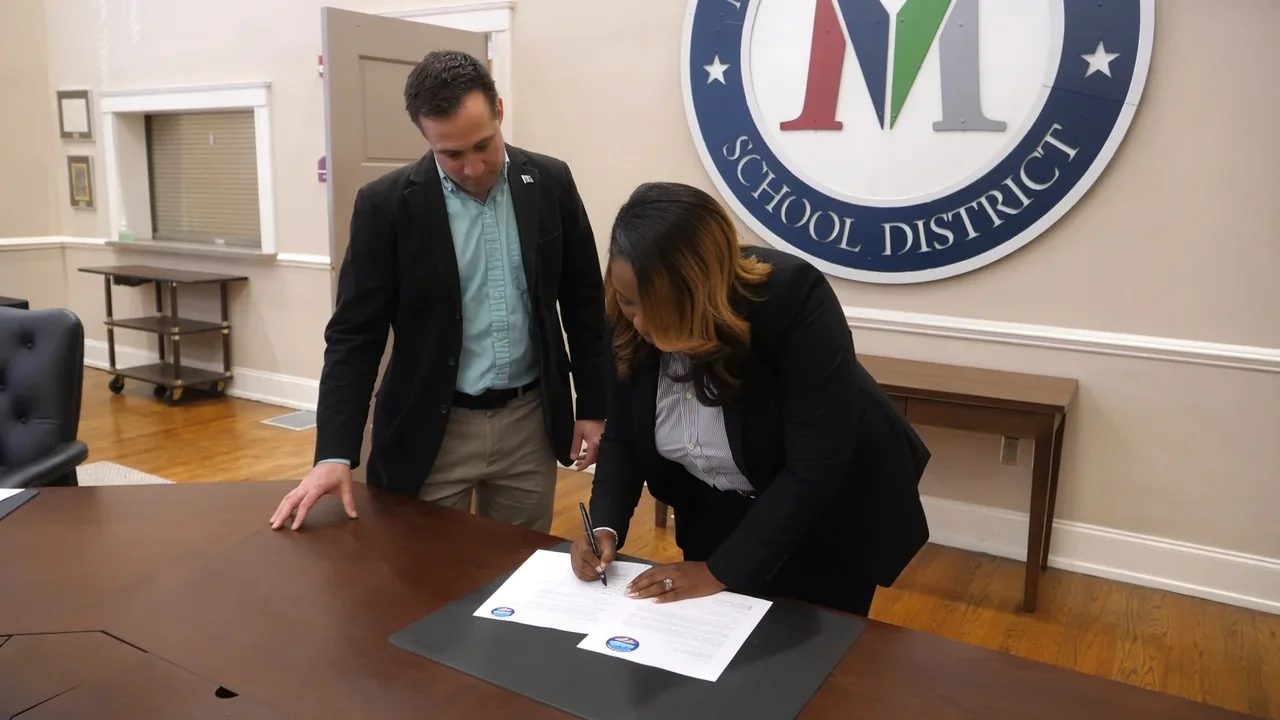 Signing the GUIDE partnership with the Marion County School District